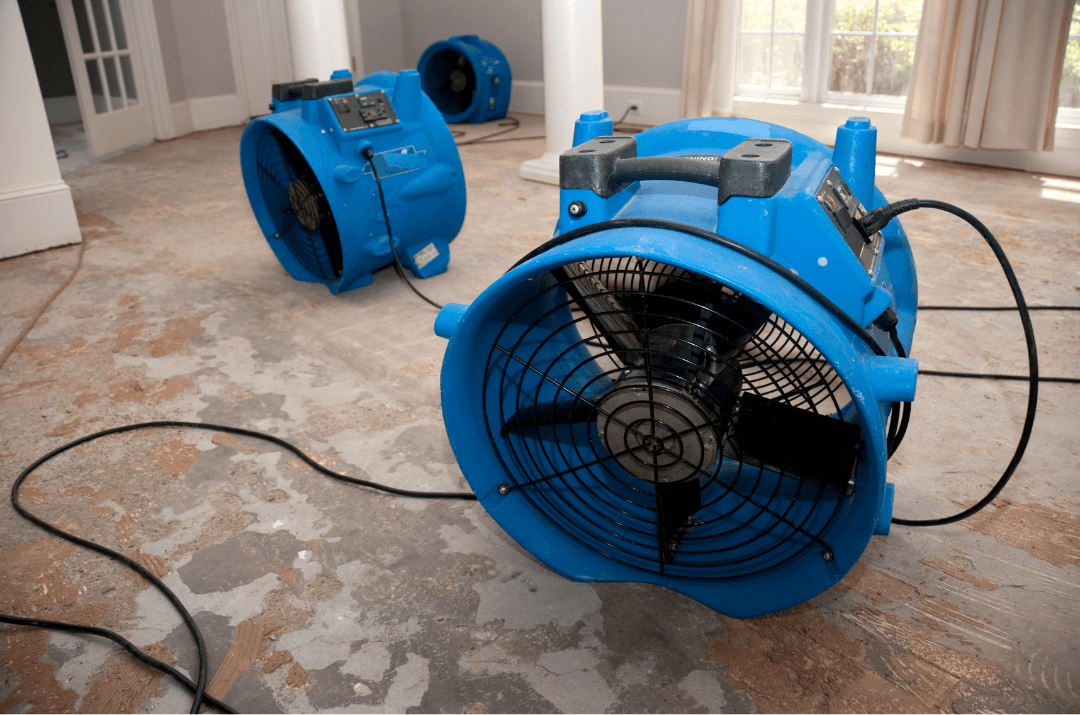 industrial fans helping Boca Raton restoration company clear up water on floor